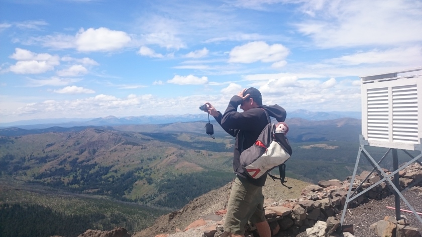 Tourist Steve taking photos on the summit of Mt. Washburn.